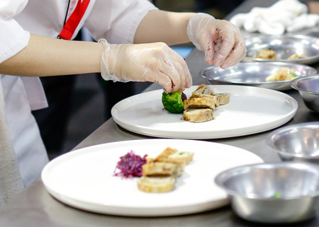 Chef cooking food in the kitchen, Chef preparing foodの写真素材