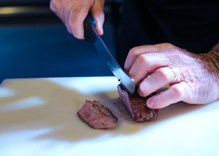Chef preparing food, meal, in the kitchen, chef cooking, Chef decorating dish, closeupの写真素材