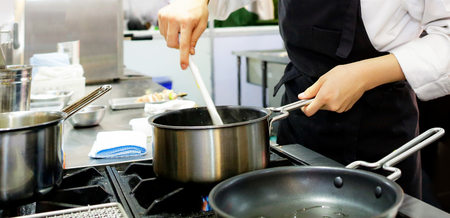 Chef preparing food, meal, in the kitchen, chef cooking, Chef decorating dish, closeupの写真素材