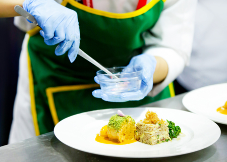 Chef preparing food, meal, in the kitchen, chef cooking, Chef decorating dish, closeupの写真素材