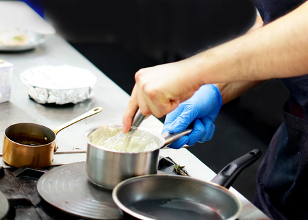 Chef preparing food, meal, in the kitchen, chef cooking, Chef decorating dish, closeupの写真素材