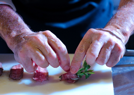 Chef preparing food, meal, in the kitchen, chef cooking, Chef decorating dish, closeupの写真素材