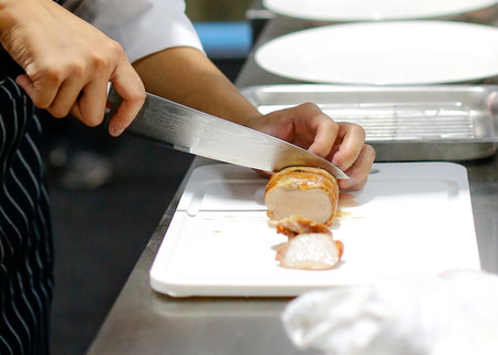 Chef preparing food, meal, in the kitchen, chef cooking, Chef decorating dish, closeupの写真素材