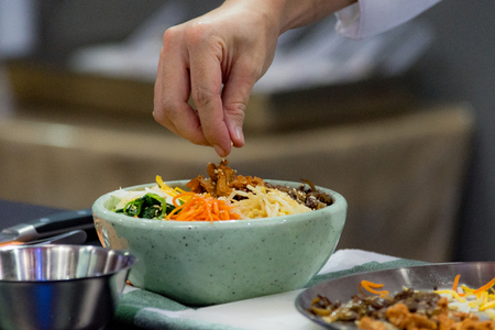 Bibimbap, Traditional Korean cuisine bibimbap, Chef preparing Korean food, chef cooking in kitchenの写真素材