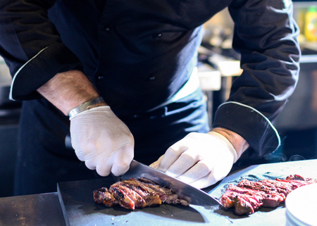 Chef preparing food, meal, in the kitchen, chef cooking, Chef decorating dish, closeupの写真素材