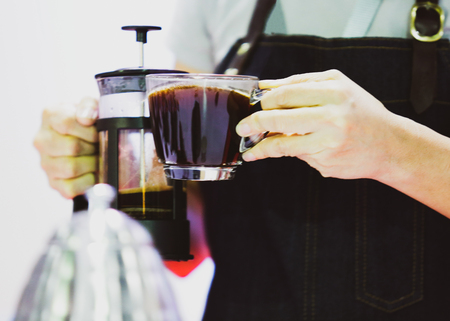 Barista is making coffee, coffee preparing with coffee presser, Dripping hot fresh coffeeの写真素材