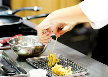 Chef preparing food, meal, in the kitchen, chef cooking, Chef decorating dish, closeupの写真素材