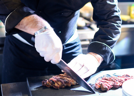 Chef preparing food, meal, in the kitchen, chef cooking, Chef decorating dish, closeupの写真素材