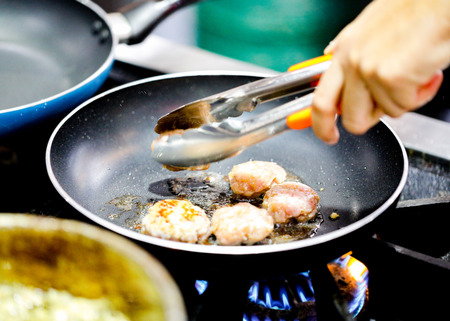 Chef preparing food, meal, in the kitchen, chef cooking, Chef decorating dish, closeupの写真素材