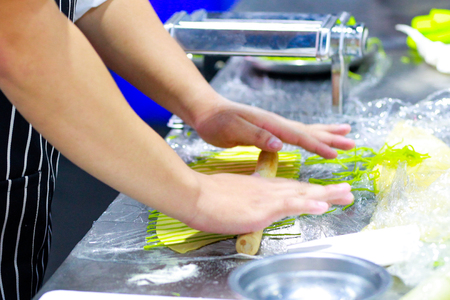 Chef Making Fresh Homemade Pasta, cooking Italian pasta, or noodlesの写真素材