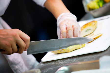 Chef preparing food, meal, in the kitchen, chef cooking, Chef decorating dish, closeupの写真素材