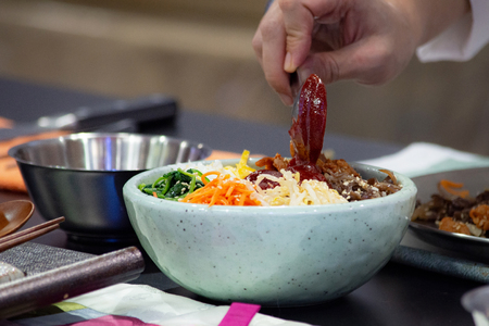 Bibimbap, Traditional Korean cuisine bibimbap, Chef preparing Korean food, chef cooking in kitchenの写真素材