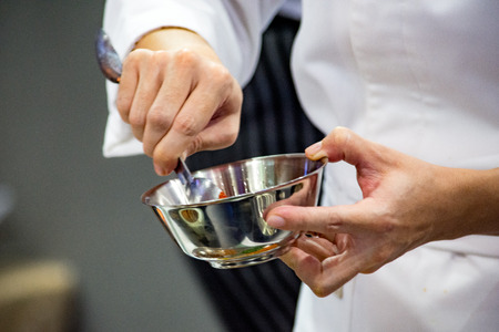 Chef preparing food, meal, in the kitchen, chef cooking, Chef decorating dish, closeupの写真素材