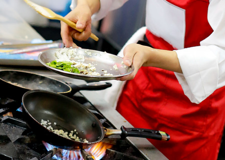 Chef preparing food, meal, in the kitchen, chef cooking, Chef decorating dish, closeupの写真素材