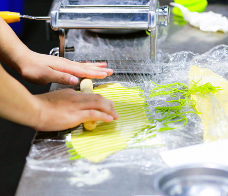 Chef Making Fresh Homemade Pasta, cooking Italian pasta, or noodlesの写真素材