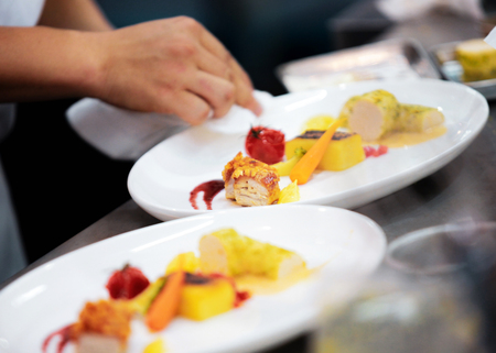 Chef preparing food, meal, in the kitchen, chef cooking, Chef decorating dish, closeupの写真素材