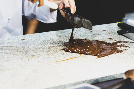 Chocolate fudge frosting, making chocolate fudgeの写真素材
