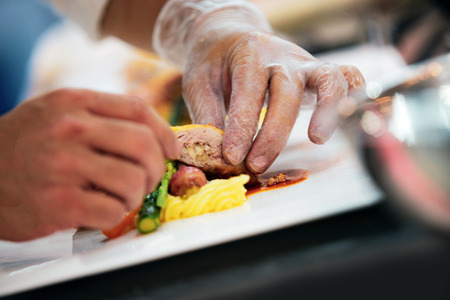 Chef preparing food, meal, in the kitchen, chef cooking, Chef decorating dish, closeupの写真素材