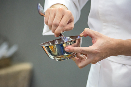 Chef preparing food, meal, in the kitchen, chef cooking, Chef decorating dish, closeupの写真素材