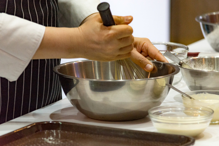 chef making dough on kitchen, Mixing Butter Milk Pastry Bakery, cook and cakeの写真素材