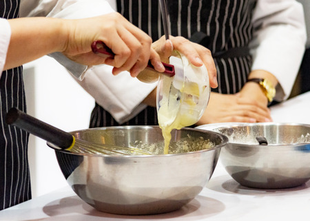 chef making dough on kitchen, Mixing Butter Milk Pastry Bakery, cook and cakeの写真素材