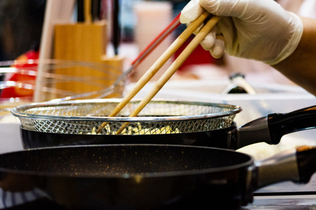 Chef preparing food, meal, in the kitchen, chef cooking, Chef decorating dish, closeupの写真素材