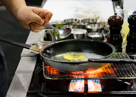 Chef preparing food, meal, in the kitchen, chef cooking, Chef decorating dish, closeupの写真素材