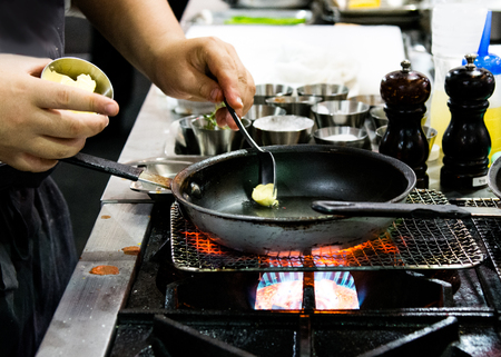 Chef preparing food, meal, in the kitchen, chef cooking, Chef decorating dish, closeupの写真素材