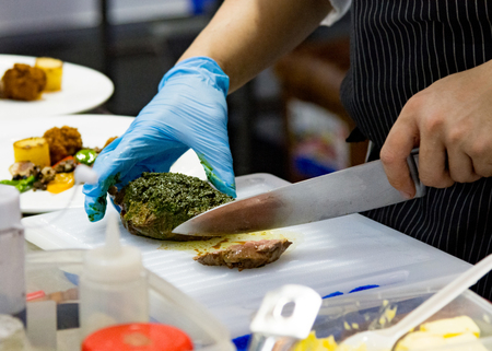 Chef preparing food, meal, in the kitchen, chef cooking, Chef decorating dish, closeupの写真素材