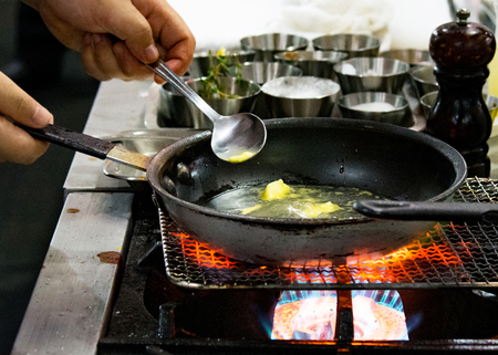 Chef preparing food, meal, in the kitchen, chef cooking, Chef decorating dish, closeupの写真素材