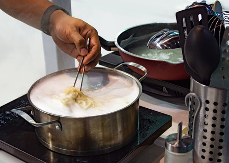 Chef preparing food, meal, in the kitchen, chef cooking, Chef decorating dish, closeupの写真素材
