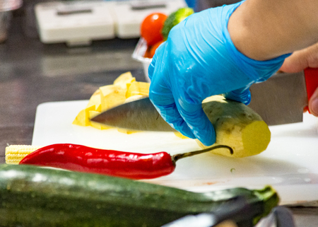Chef cooking food, vegetables in the kitchenの写真素材