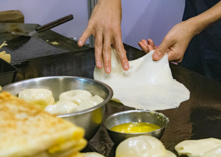 Making of Roti Canai, cooking process, Indian traditional street foodの写真素材