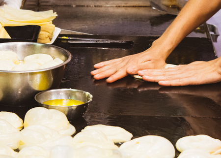 Making of Roti Canai, cooking process, Indian traditional street foodの写真素材