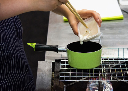 Chef preparing food, meal, in the kitchen, chef cooking, Chef decorating dish, closeupの写真素材