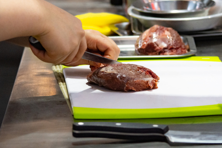Chef preparing food, meal, in the kitchen, chef cooking, Chef decorating dish, closeupの写真素材