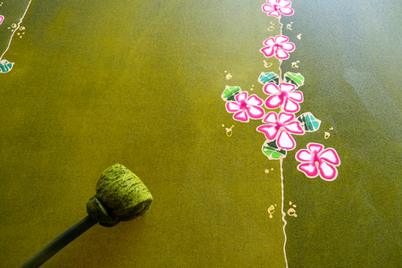Painting watercolor on the fabric to make Batik, Making Batik, painting traditional batikの写真素材