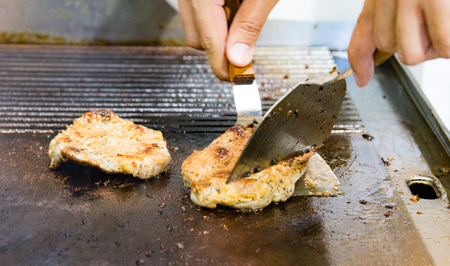 chef cooking beef steak, Teppanyaki in restaurant, selective focus, closeupの写真素材