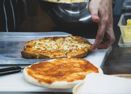 Chef preparing pizza , The process of making pizzaの写真素材