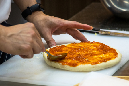 Chef preparing pizza , The process of making pizzaの写真素材