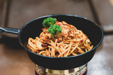 Spaghetti Stir Fried  with mushrooms on wooden tableの写真素材