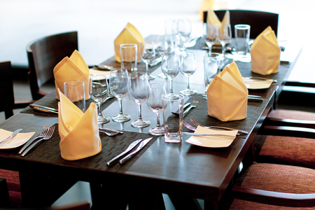 table setting in wedding decoration, Serving table in restaurant with wine glasses and cutlery. Table served for wedding banquet. Table settingの写真素材