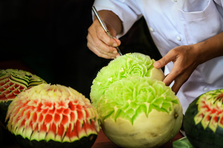 Thai fruit carving with hand, Vegetable and Fruit Carvingの写真素材