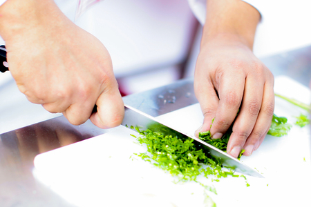 Chef preparing food, meal, in the kitchen, chef cooking, Chef decorating dish, closeupの写真素材