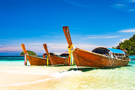 Long tail boat on tropical beach, Andaman Sea Thailandの写真素材
