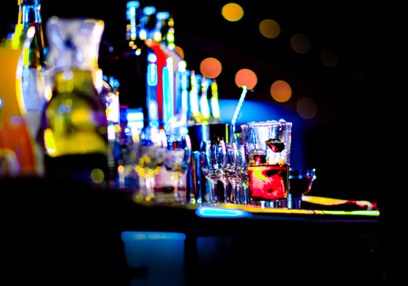 Bartender making alcohol cocktail at bar counter at nightclub, barman is making cocktailの写真素材
