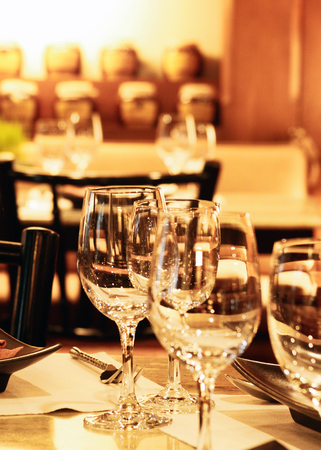 Glasses for wine and champagne at a buffet table, Group of empty wine glasses, Elegant table setの写真素材