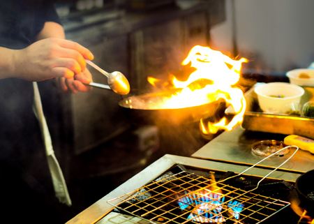 Chef preparing food, meal, in the kitchen, chef cooking, Chef decorating dish, closeupの写真素材