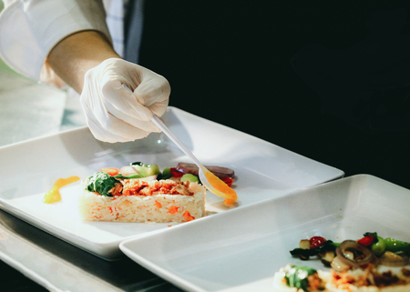 Chef preparing food, meal, in the kitchen, chef cooking, Chef decorating dish, closeupの写真素材