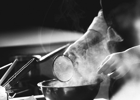 Chef preparing food, meal, in the kitchen, chef cooking, Chef decorating dish, closeupの写真素材